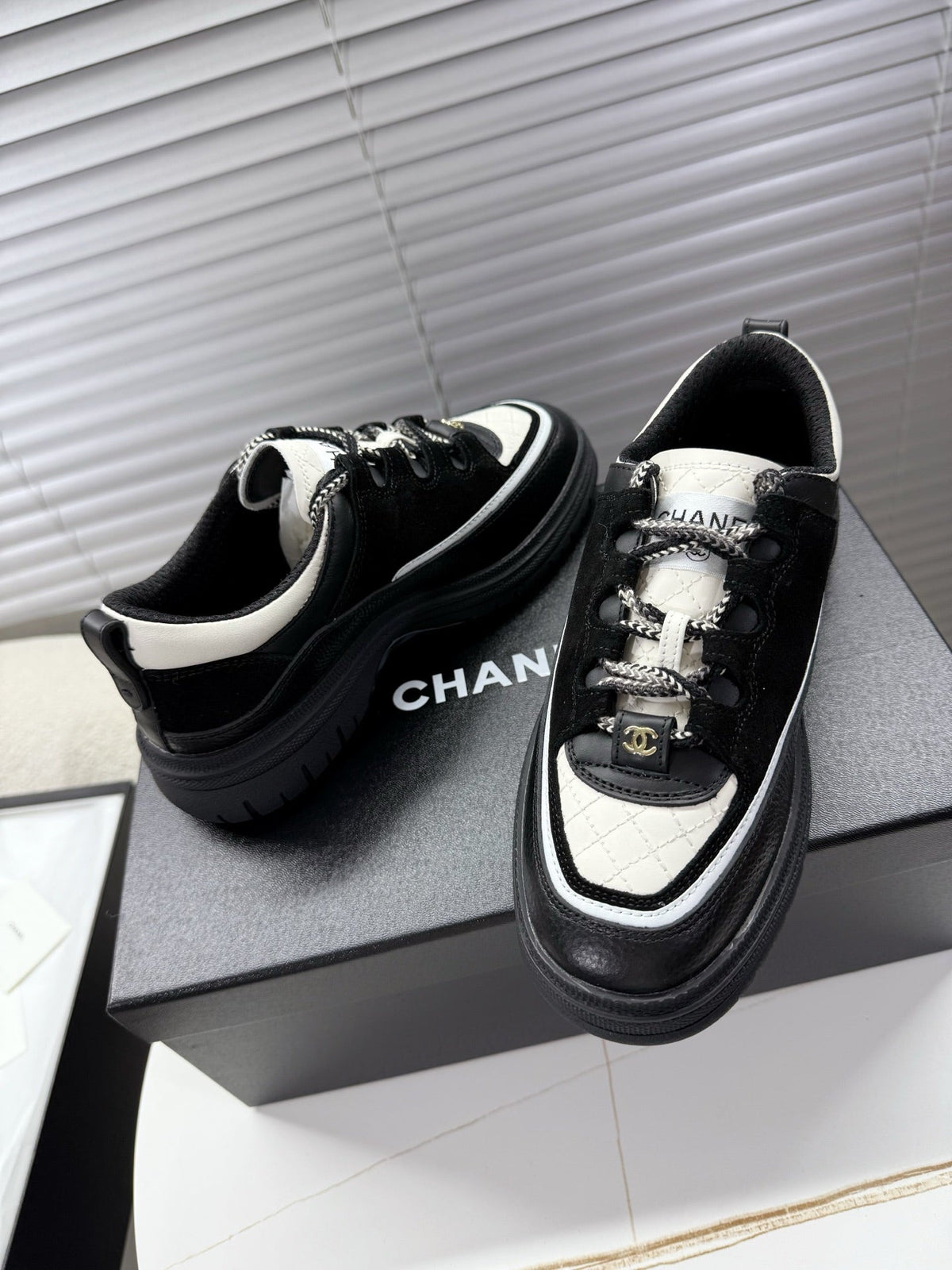CHANEL 25S SNEAKERS 35MM IN BLACK AND WHITE CALFSKIN