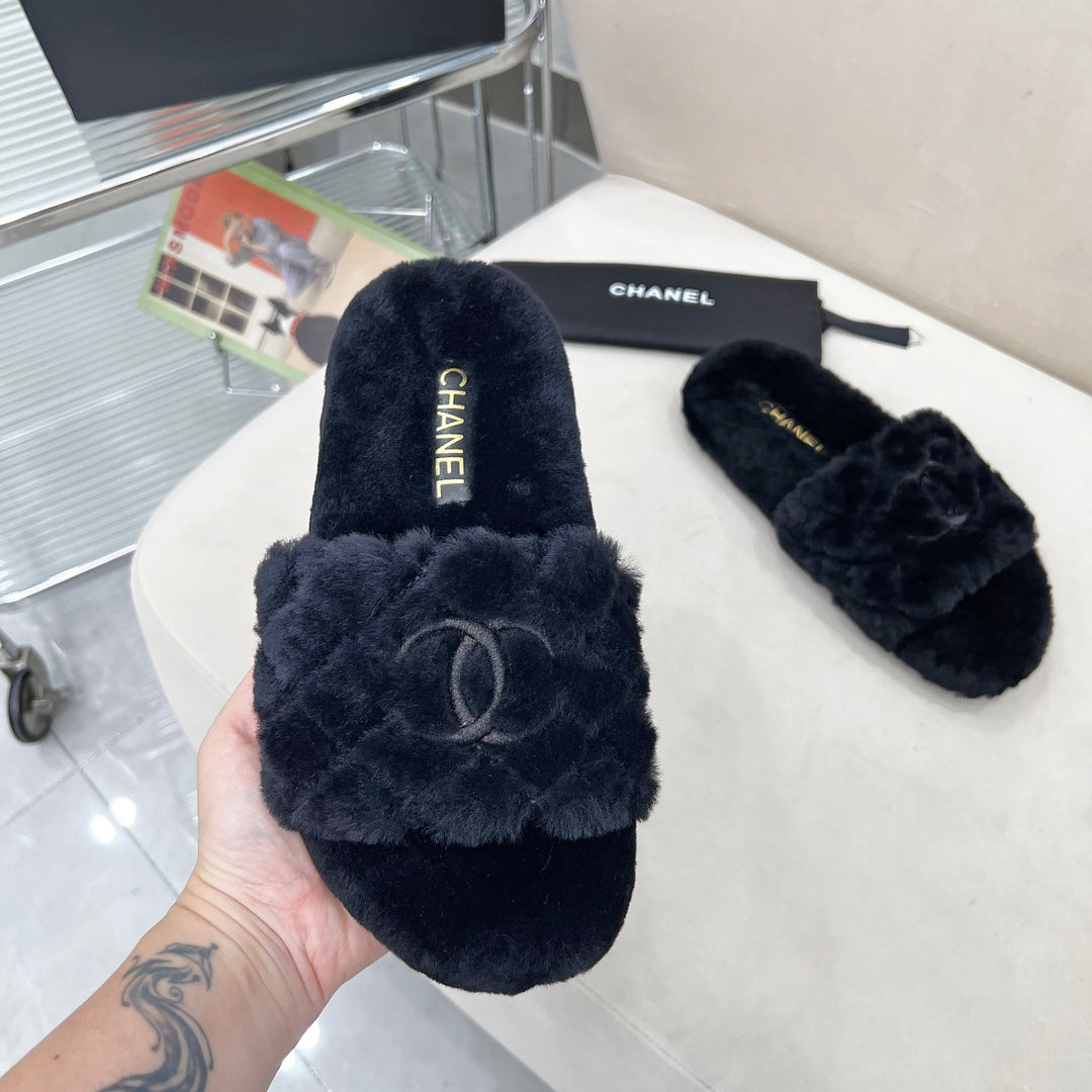 CHANEL 25S FUR SLIPPERS WITH EXPOSED-STITCH STRAPS IN BLACK