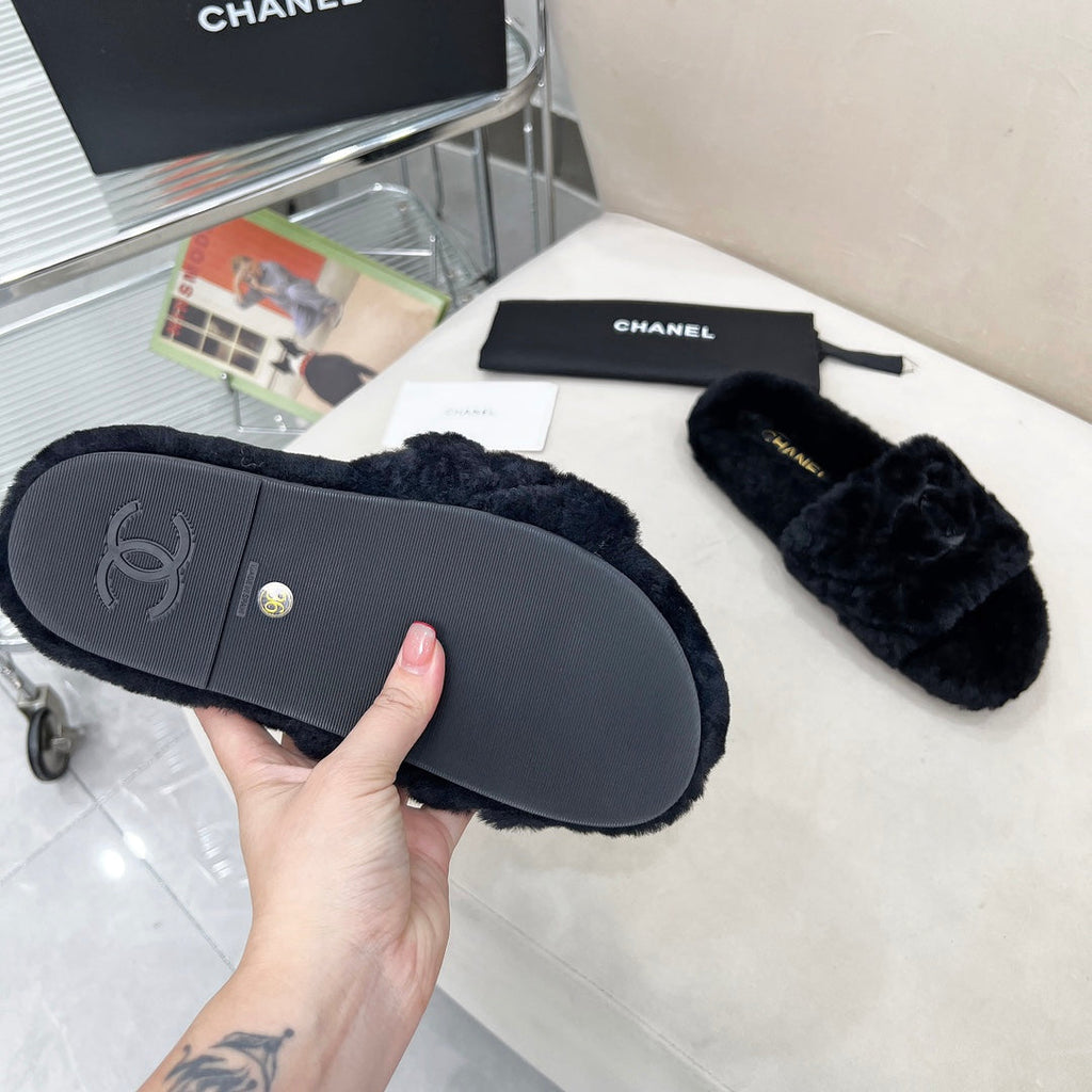 CHANEL 25S FUR SLIPPERS WITH EXPOSED-STITCH STRAPS IN BLACK
