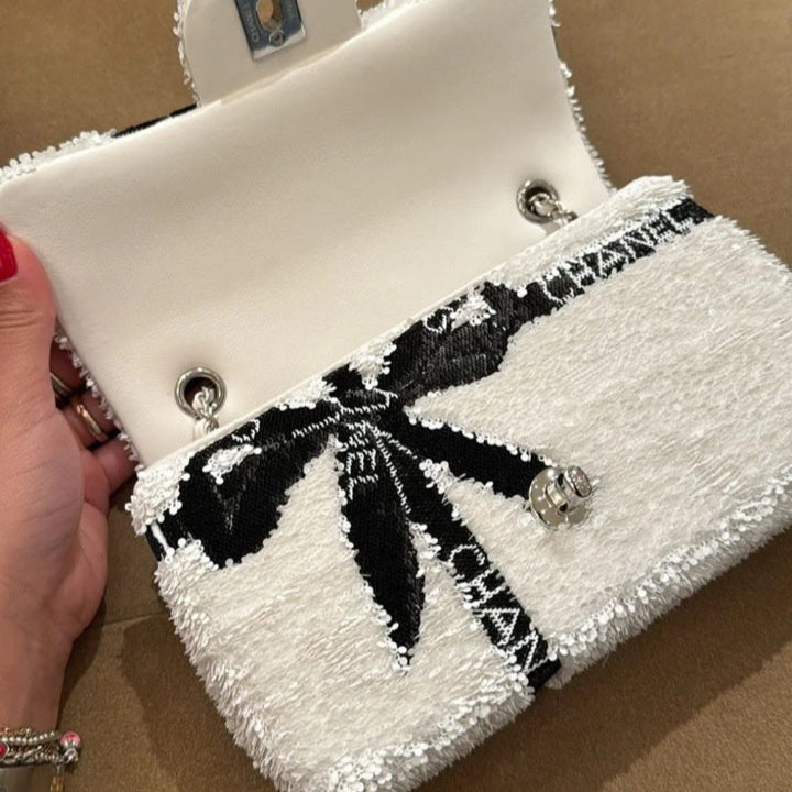 CHANEL 25S FLAP BAG 20 CM IN WHITE SEQUINS WITH BLACK BOW