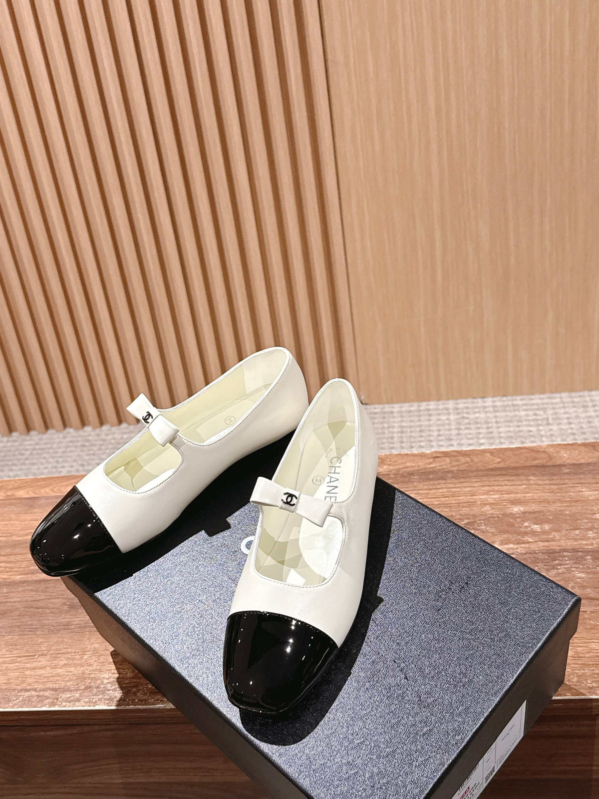 CHANEL 25S BALLET MARY JANES BLACK AND IVORY IN CALFSKIN